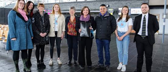 A group of people posing for the camera

Description automatically generated