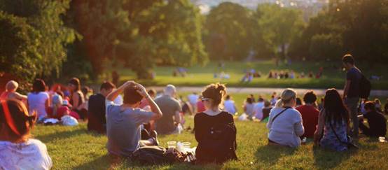 A group of people in a park

Description automatically generated
