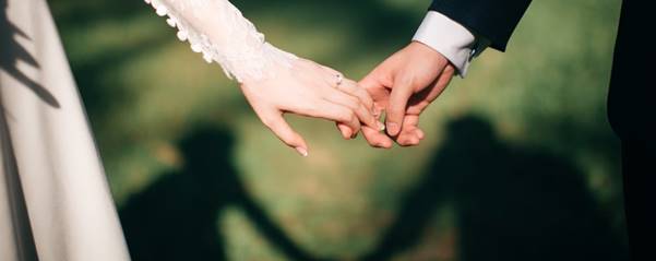 man and woman holding hands focus photo
