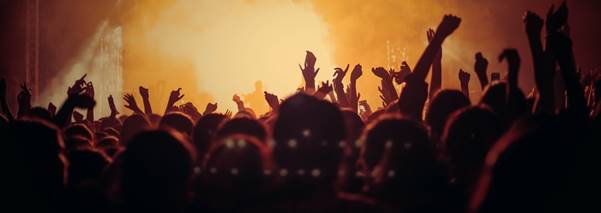 band performing on stage in front of people
